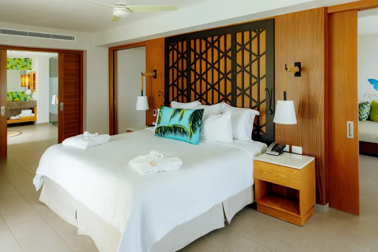 Preferred Club Master Suite Ocean View king bed with modern décor at Dreams Natura Resort & Spa.