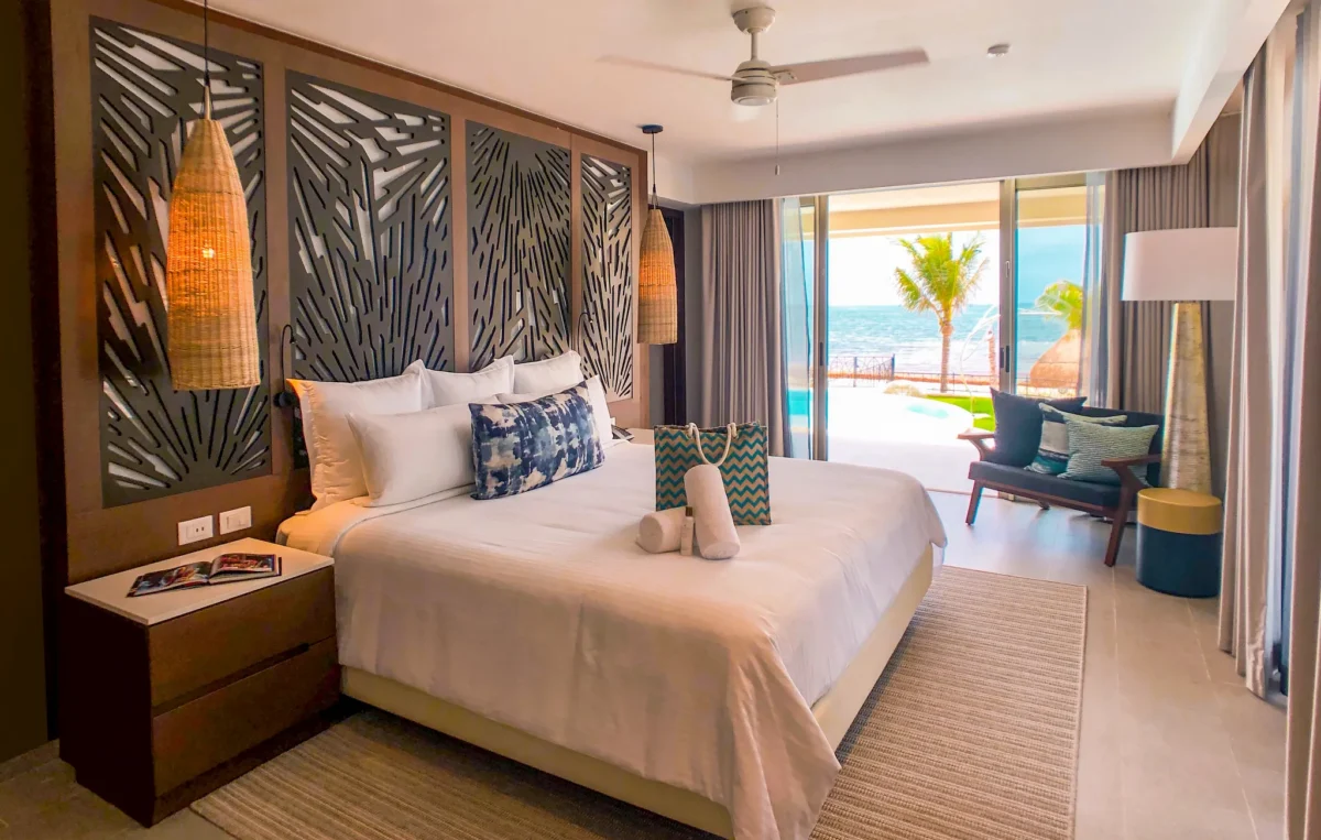 Preferred Club Presidential Suite king bedroom with balcony access at Dreams Natura Resort & Spa.