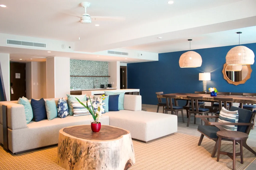 Preferred Club Presidential Suite open living and dining area with modern décor at Dreams Natura Resort & Spa.