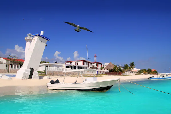 Puerto Morelos Beach near Dreams Natura Resort & Spa with relaxed shoreline and clear Caribbean waters