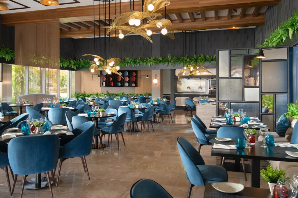 Bluewater Grill steakhouse at Dreams Onyx Resort & Spa featuring elegant indoor dining, premium steaks, and a contemporary upscale ambiance.