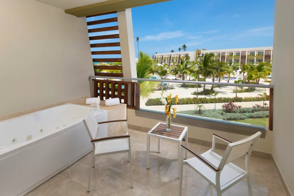 Junior Suite Garden View terrace with hot tub and resort garden views at Dreams Onyx Resort & Spa.