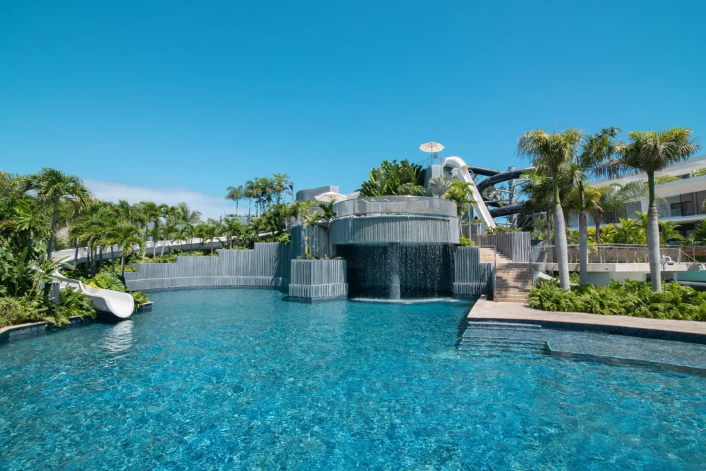 Large main pool with loungers and palm trees at Dreams Onyx Resort & Spa in Punta Cana.