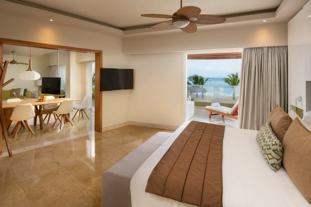 King bedroom with balcony view in Preferred Club Presidential Suite at Dreams Onyx Resort & Spa.