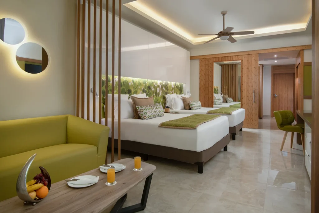 Premium Junior Suite Pool View with two queen beds and modern décor at Dreams Onyx Resort & Spa.