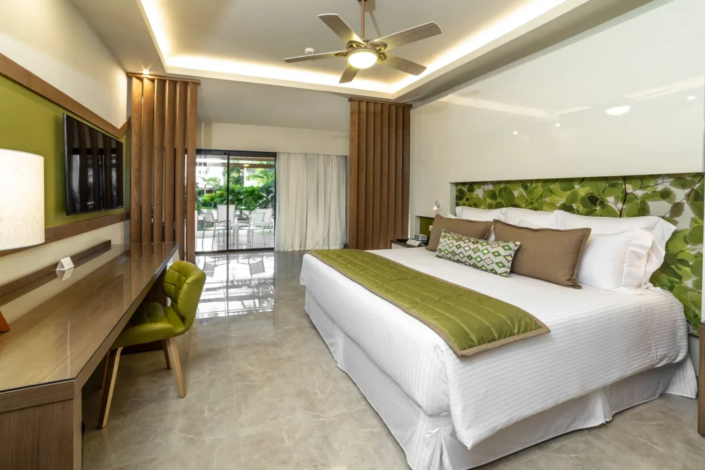 Premium Junior Suite Tropical View king room with balcony access at Dreams Onyx Resort & Spa.