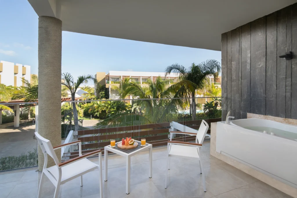 Premium Junior Suite terrace with hot tub and tropical garden views at Dreams Onyx Resort & Spa.