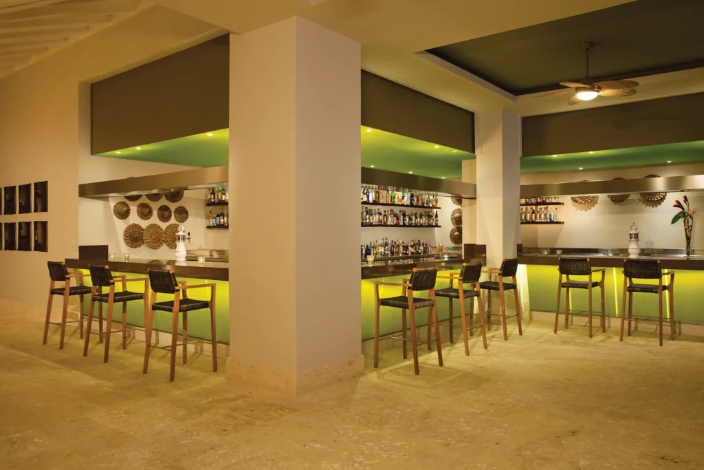 Spotlight Theater Bar at Dreams Onyx Resort & Spa featuring a lively entertainment venue, stage performances, and a vibrant bar atmosphere.