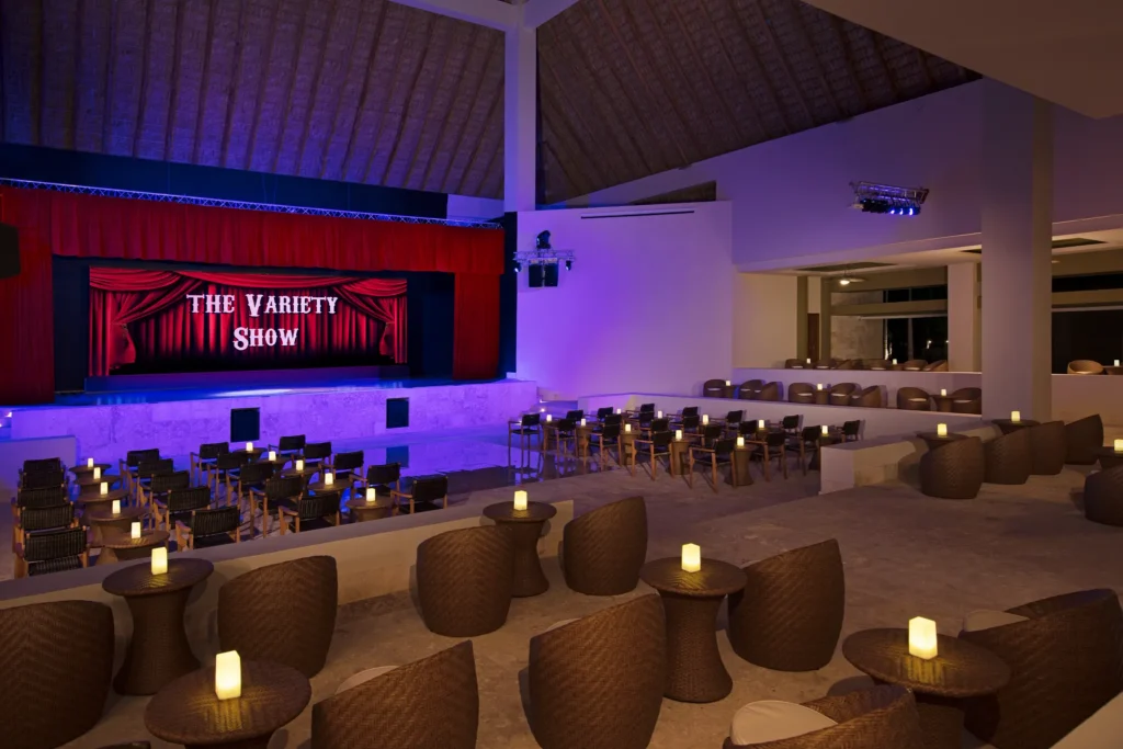 Outdoor theater seating and stage for live entertainment at Dreams Onyx Resort & Spa.