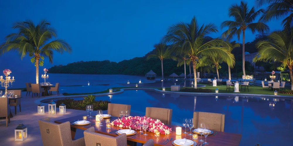 Infinity Pool evening wedding reception setup at Dreams Playa Bonita Panama