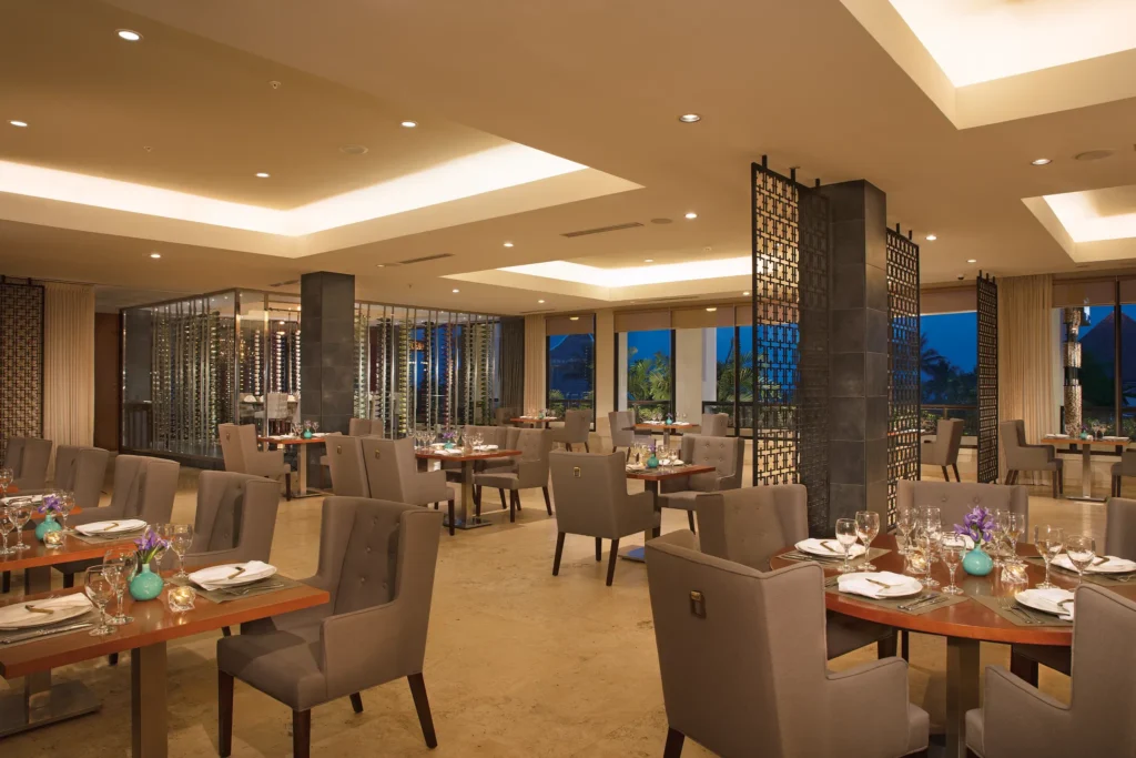 Portofino restaurant at Dreams Playa Bonita Panama featuring elegant Italian dining, modern décor, and panoramic ocean and garden views.
