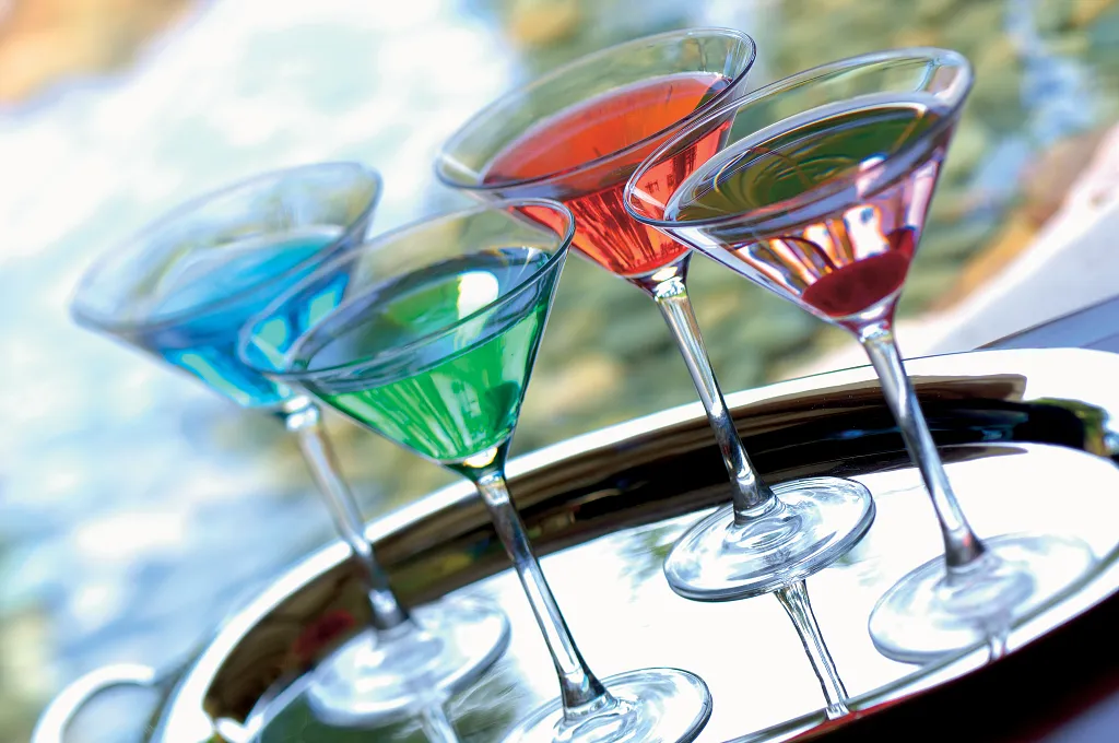 Preferred Club Pool Bar at Dreams Playa Bonita Panama featuring colorful signature cocktails served poolside in an exclusive lounge setting.