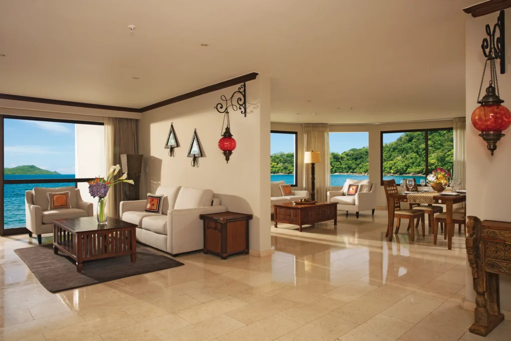 Preferred Club One-Bedroom Presidential Suite Ocean View living and dining area at Dreams Playa Bonita Panama.