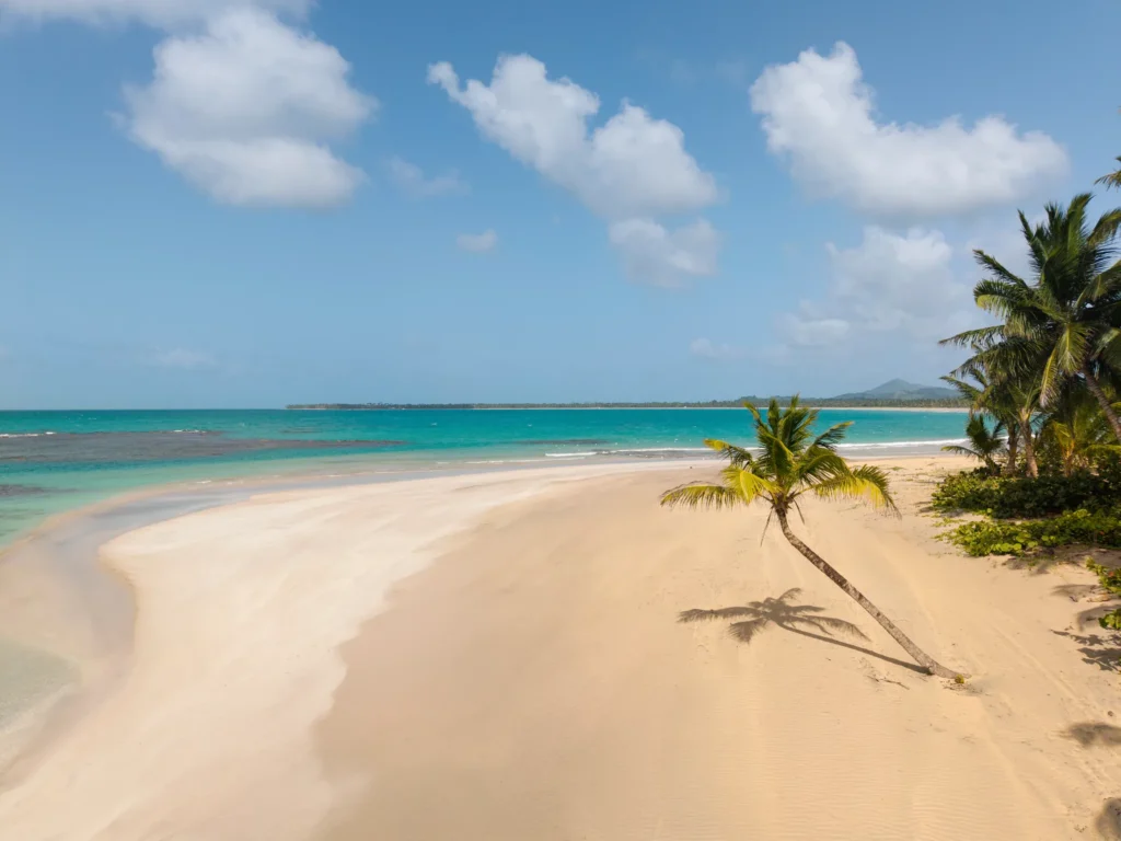 Peaceful tropical beach with soft white sand and turquoise water near Dreams Playa Esmeralda Resort & Spa.