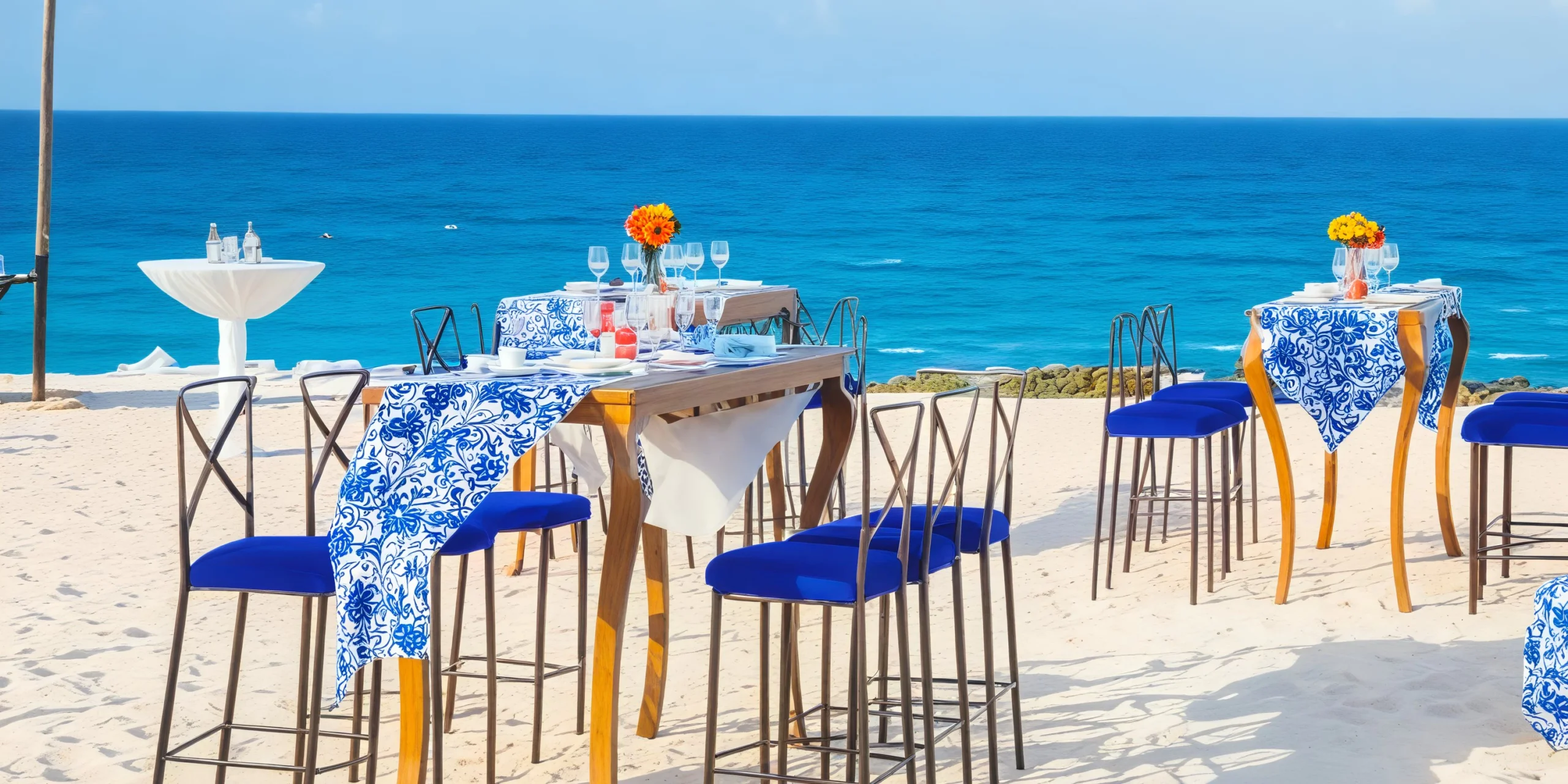 Elegant beach ceremony setup with floral arch and ocean views at Dreams Playa Mujeres Golf & Spa Resort