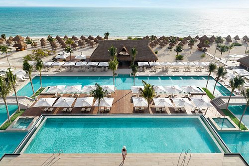Excellence Playa Mujeres adults-only all-inclusive luxury resort with pristine beach, rooftop terraces, and elegant suites near Cancun.