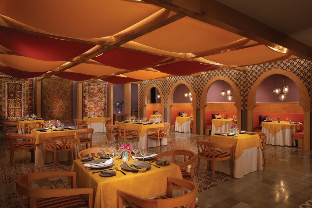 Mezés Mediterranean restaurant at Dreams Playa Mujeres Golf & Spa Resort featuring a modern dining space with shared plates and coastal-inspired ambiance.