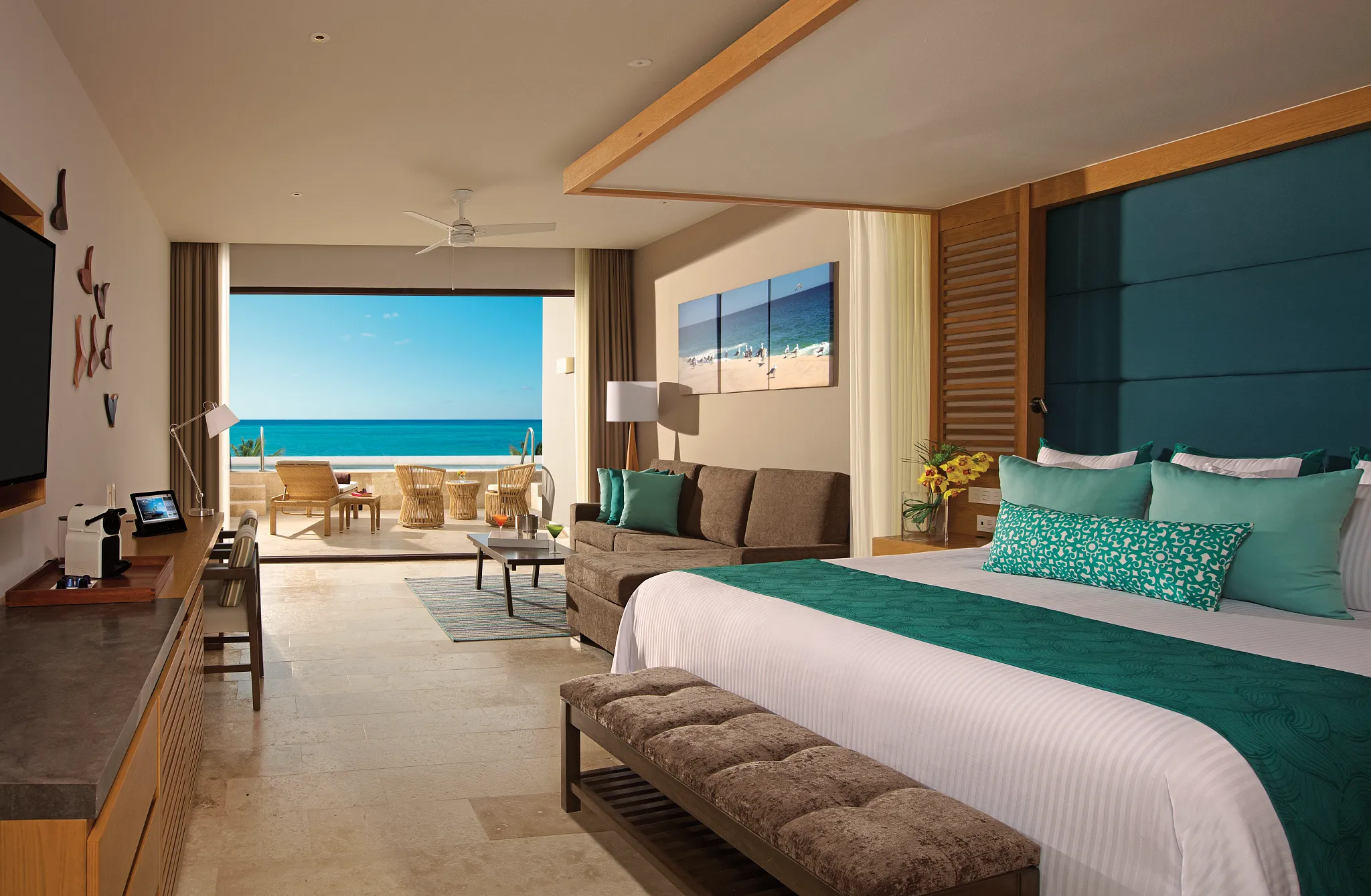 Preferred Club Junior Suite Swim Out Ocean View at Dreams Playa Mujeres with king bed and direct swim-out pool access.