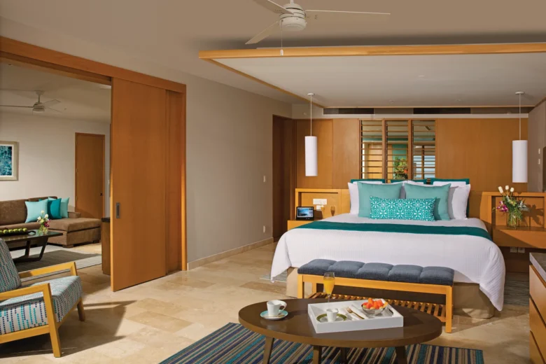 Bedroom with king bed in Preferred Club Master Suite Ocean View at Dreams Playa Mujeres.