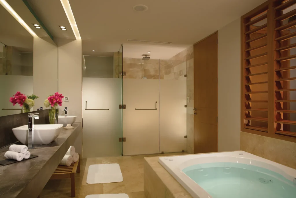 Bathroom with soaking tub and double vanities in Preferred Club Master Suite at Dreams Playa Mujeres.