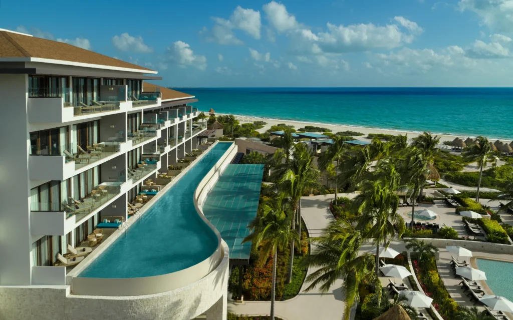 Swim-out suites with private pool access and ocean views at Dreams Playa Mujeres Resort.