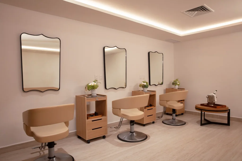 Bridal salon with styling chairs, mirrors, and vanity stations at the resort spa.
