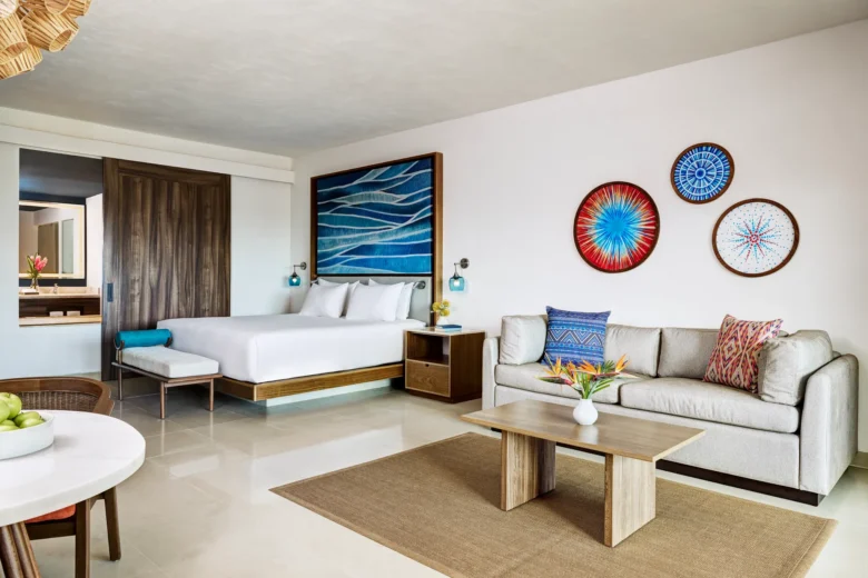 Preferred Club Junior Suite Ocean View King living area with balcony and ocean view at Dreams Puerto Morelos.