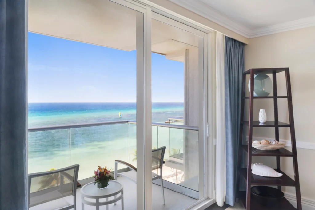 Oceanfront Prime Minister Suite balcony overlooking the Caribbean Sea at Dreams Rose Hall Resort & Spa.