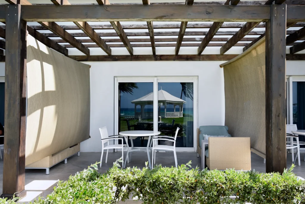 Oceanfront Walkout terrace with outdoor seating and direct beach access at Dreams Rose Hall Resort & Spa.