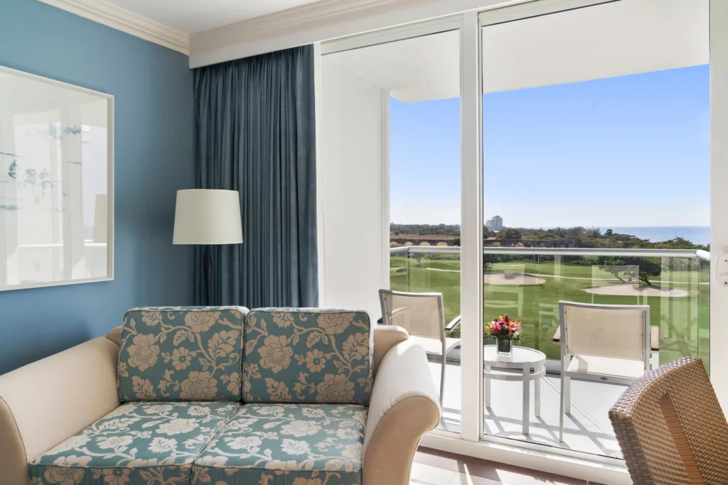 Private balcony with partial ocean views at Dreams Rose Hall Resort & Spa in Montego Bay.