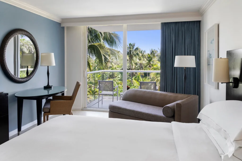 Resort View king room with tropical balcony views at Dreams Rose Hall Resort & Spa Jamaica.