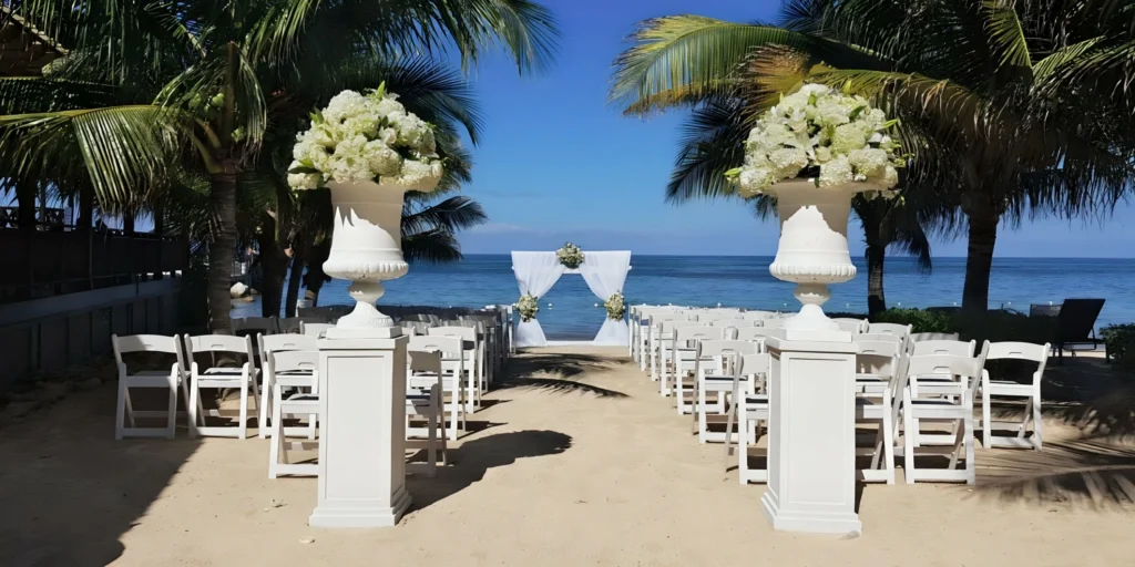 Sunrise Beach oceanfront wedding ceremony setup at Dreams Rose Hall Resort & Spa