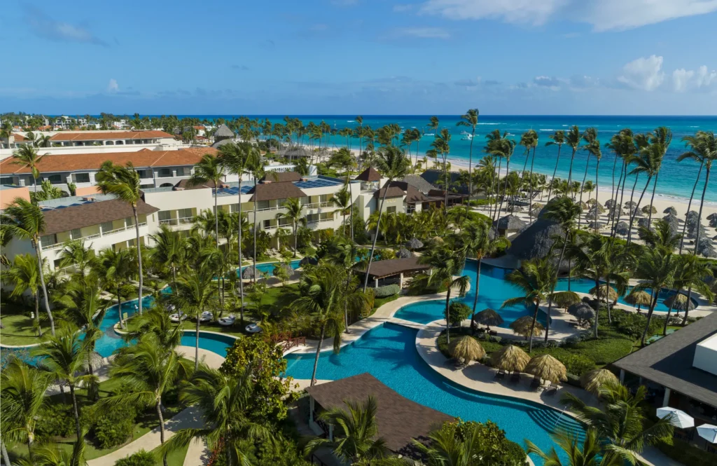 Aerial view of Dreams Royal Beach Punta Cana with pools, palm trees, and beachfront along the Caribbean Sea.