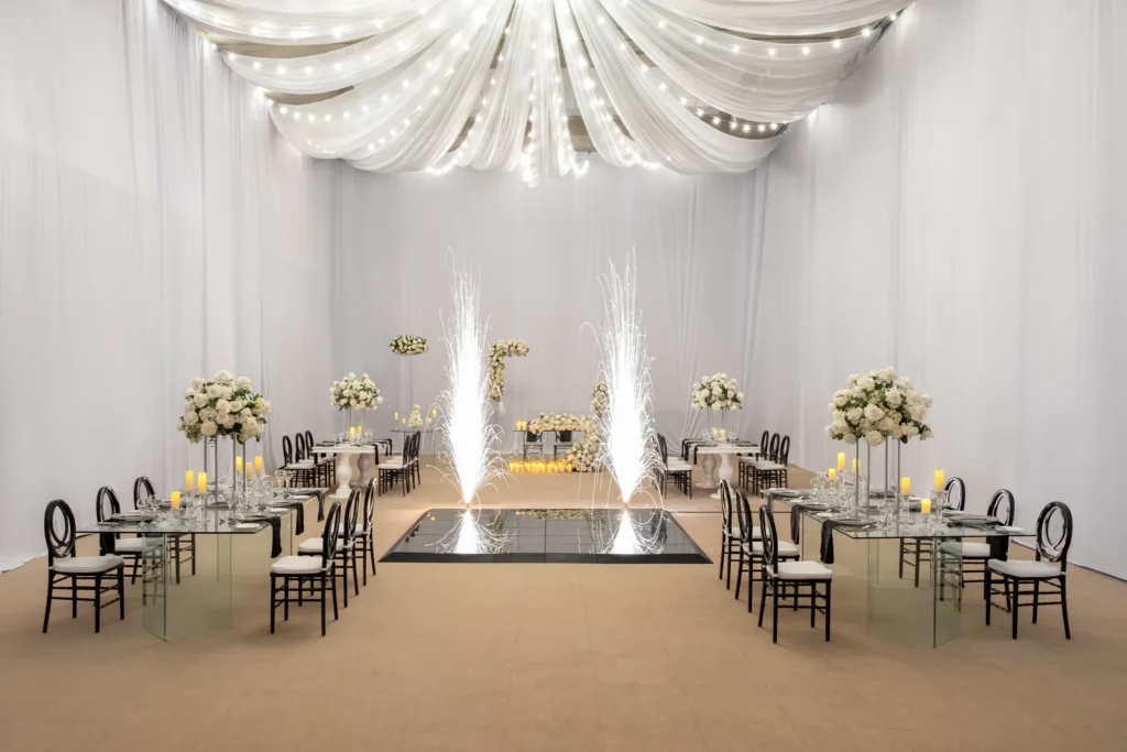 Elegant ballroom wedding reception setup with draped ceiling at Dreams Royal Beach Punta Cana