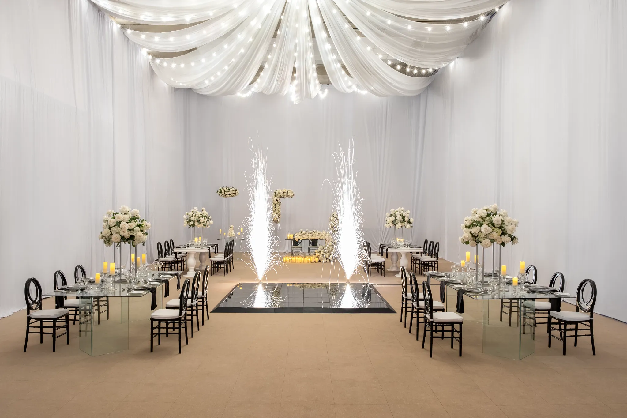 Elegant ballroom wedding reception setup with draped ceiling at Dreams Royal Beach Punta Cana