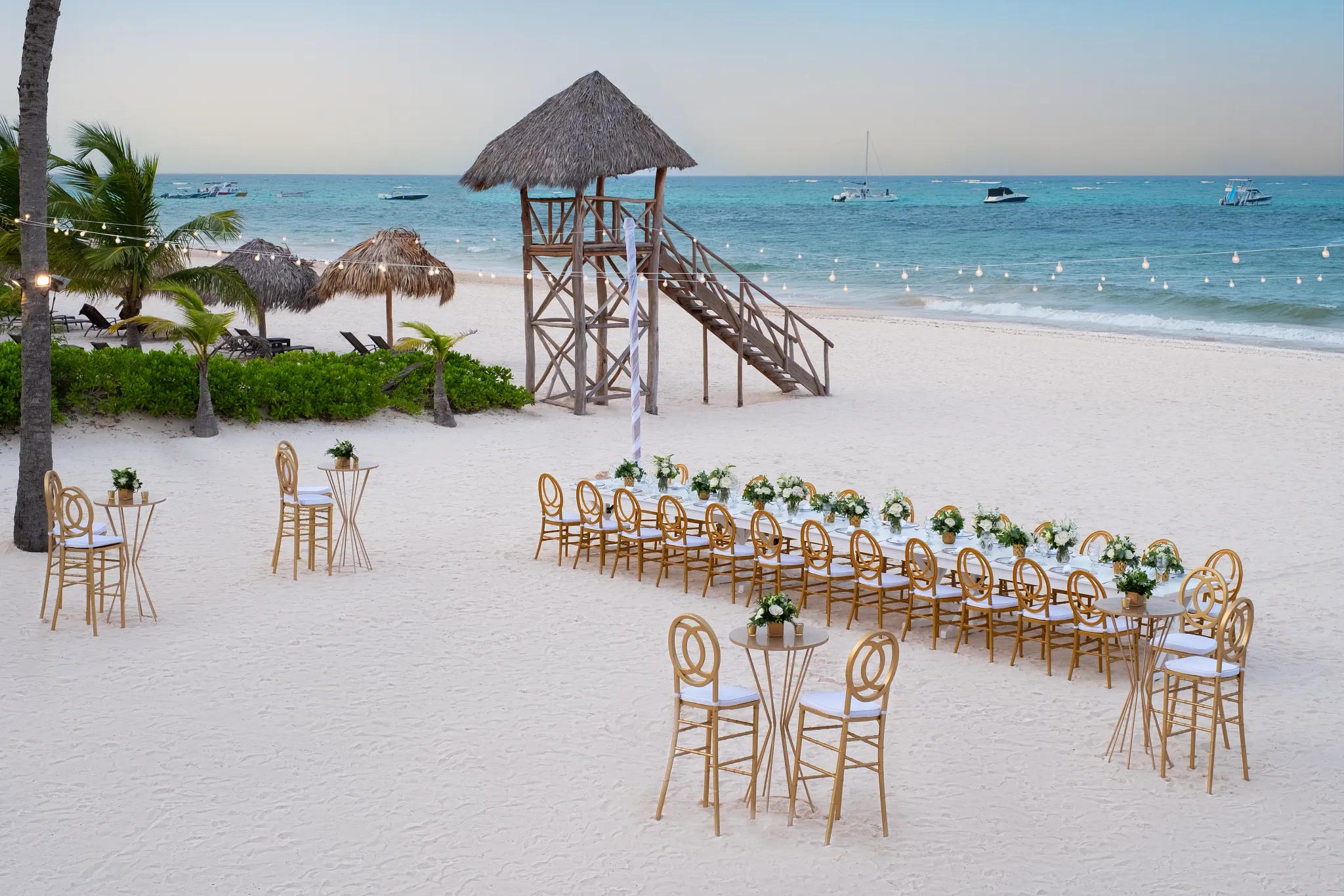Beach reception setup with long tables and ocean views at Dreams Royal Beach Punta Cana