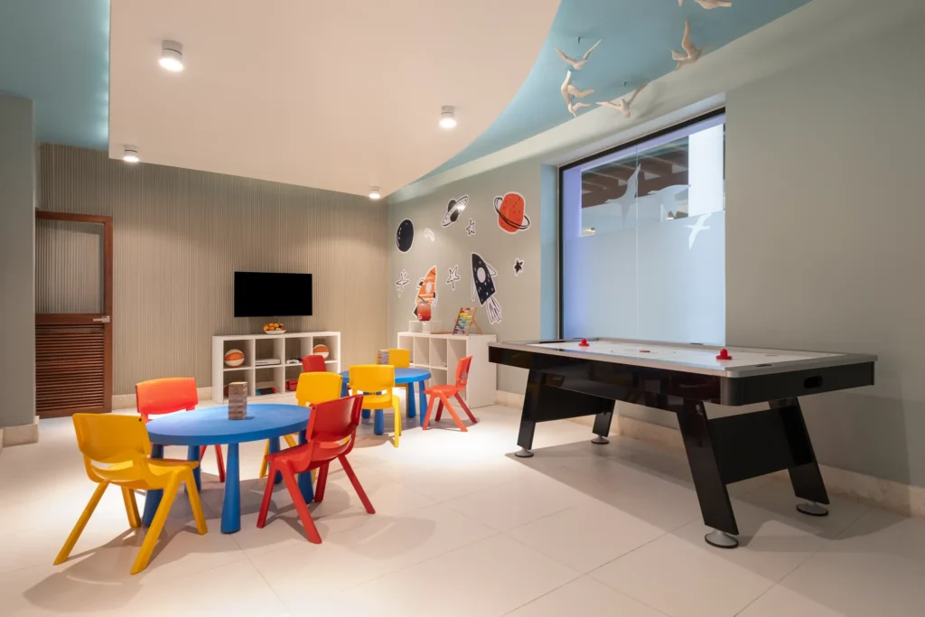 Indoor kids club with games, air hockey, and play tables at Dreams Royal Beach Punta Cana.