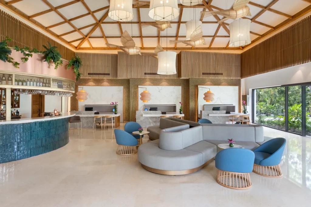 Lobby lounge area at Dreams Royal Beach Punta Cana with modern seating and bar.