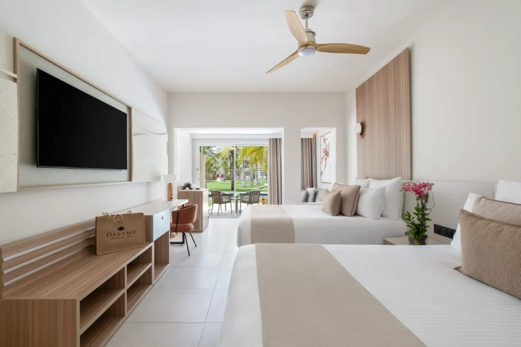 Preferred Club Family Junior Suite Pool Terrace with two double beds and pool view at Dreams Royal Beach Punta Cana.