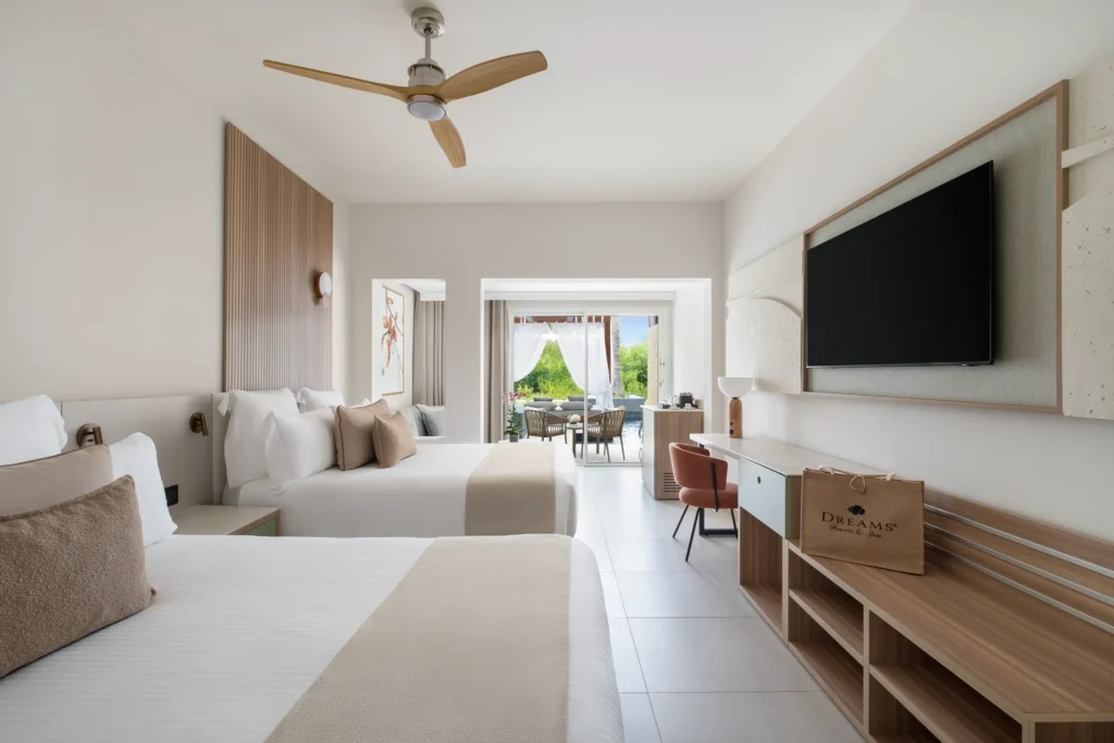 Preferred Club Junior Suite Swim Out with two double beds and pool access at Dreams Royal Beach Punta Cana.