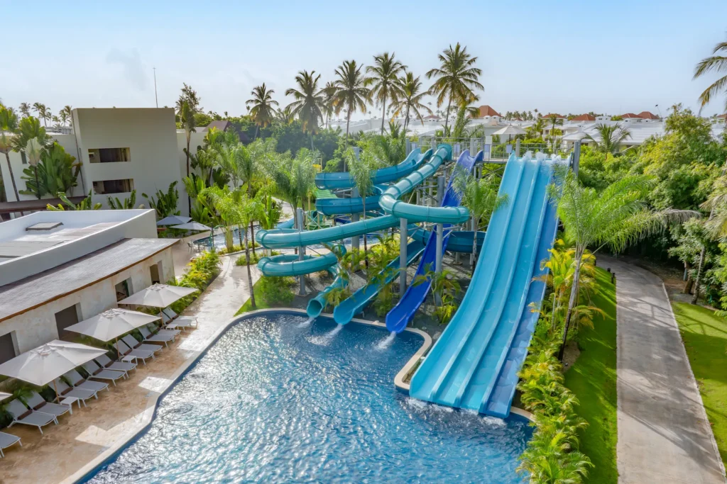 Large blue water slides and pool area at Dreams Royal Beach Punta Cana water park.