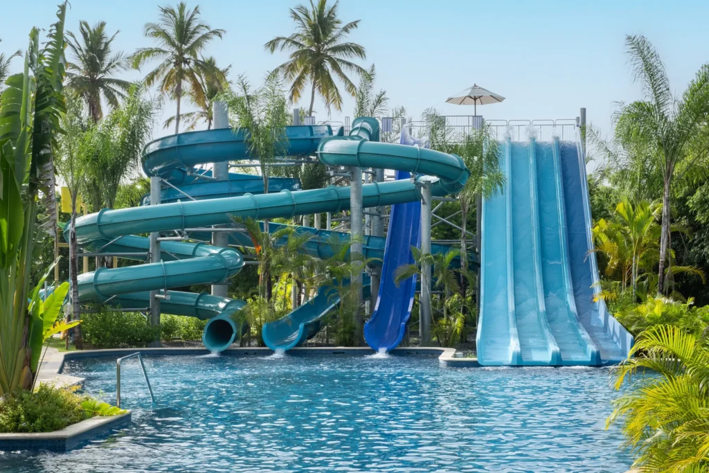 Multiple large water slides surrounded by tropical landscaping at Dreams Royal Beach Punta Cana.