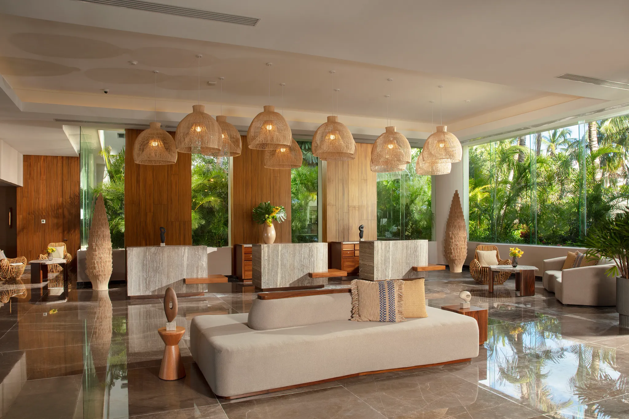 Elegant lobby with tropical decor and luxury seating at Dreams Sands Cancun Resort & Spa.