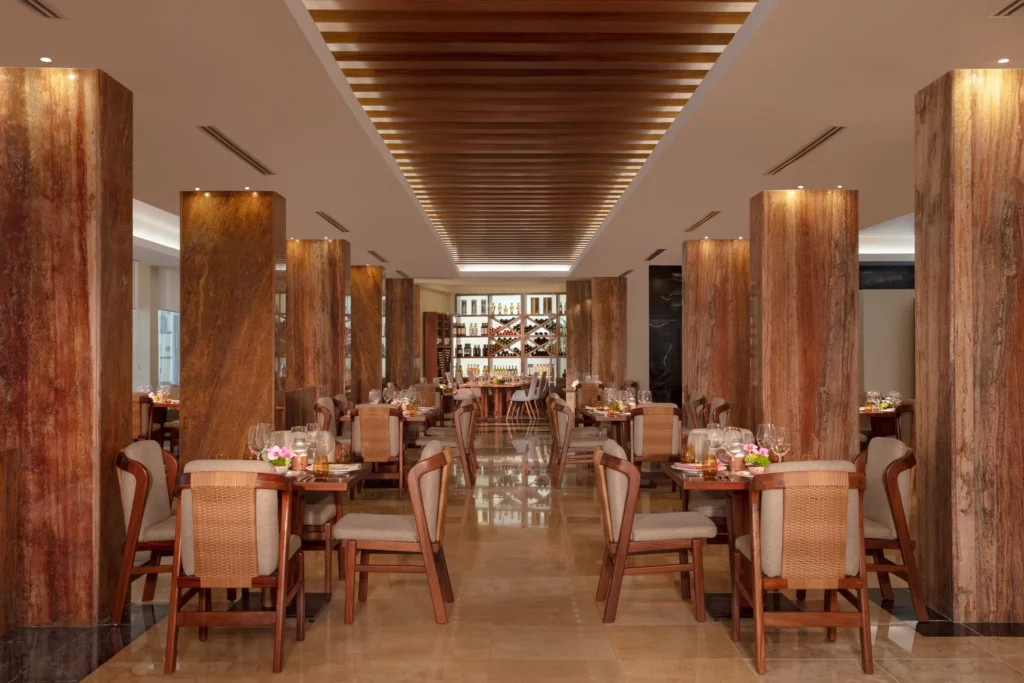 El Patio restaurant at Dreams Sands Cancun Resort & Spa featuring authentic Mexican cuisine, colorful décor, and elegant dining atmosphere.