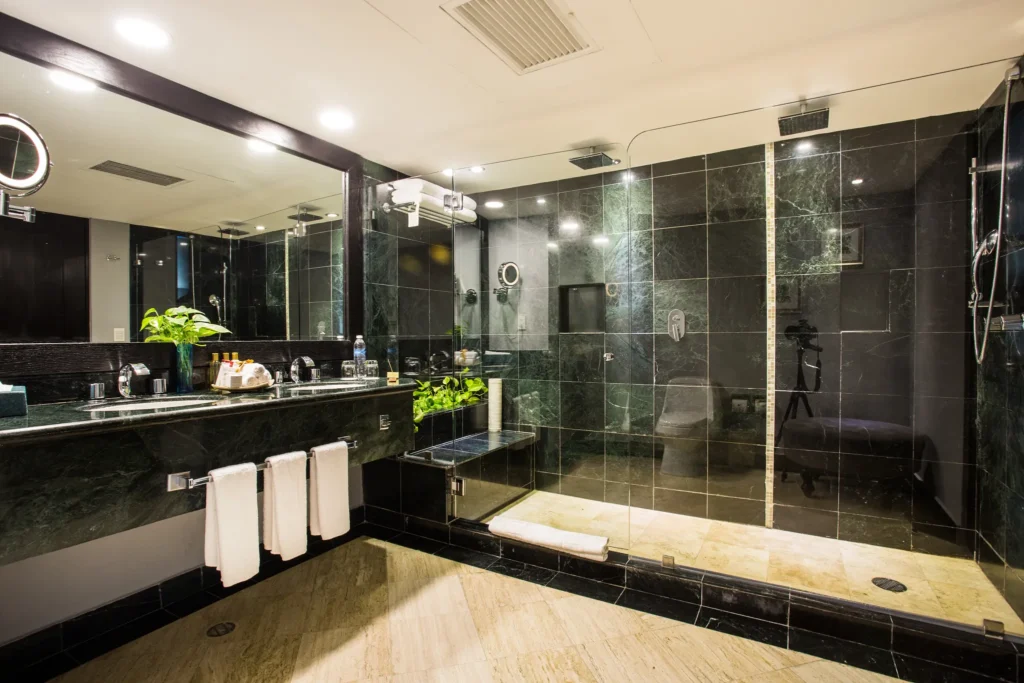 Preferred Club Junior Suite luxury bathroom with oversized walk-in shower at Dreams Sands Cancun Resort & Spa.
