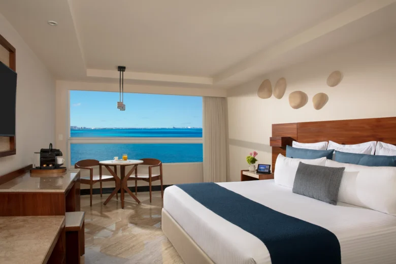 Preferred Club Premium Ocean Front king room with panoramic ocean views at Dreams Sands Cancun Resort & Spa.