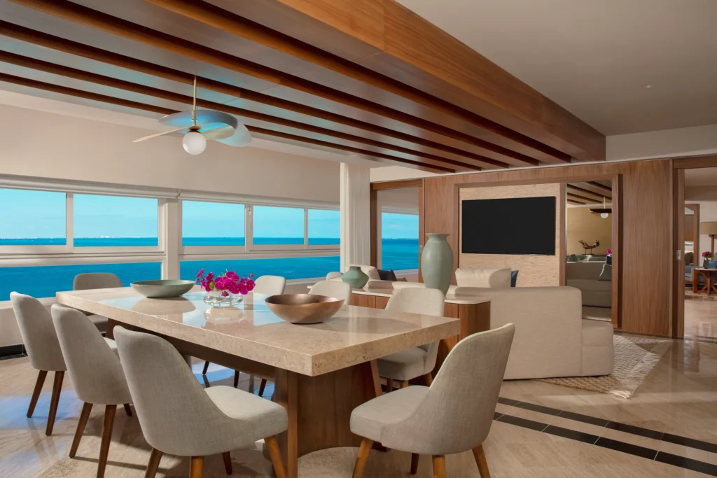 Presidential Suite dining and living area overlooking the ocean at Dreams Sands Cancun Resort & Spa.