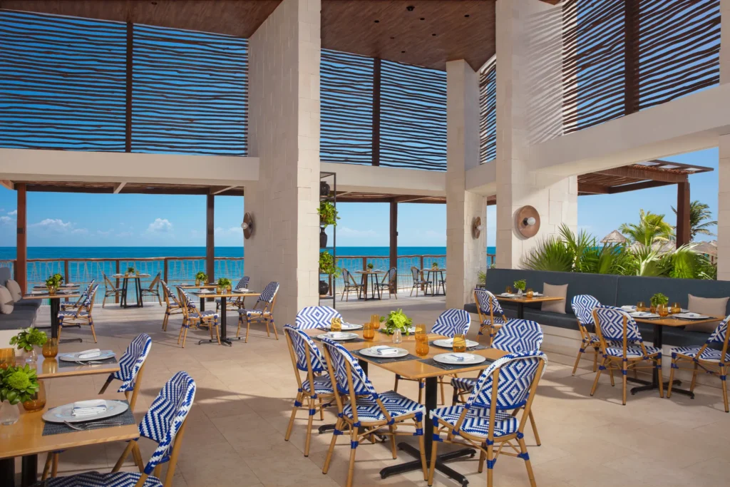 Bluewater Grill at Dreams Sapphire Resort & Spa featuring an upscale steakhouse atmosphere, premium cuts of meat, and elegant indoor dining.