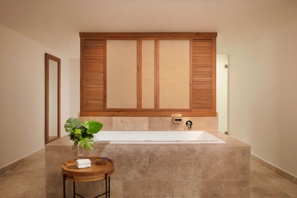 Club Master Suite Ocean Front Swim Out soaking tub in luxurious master bathroom at Dreams Sapphire Resort & Spa.