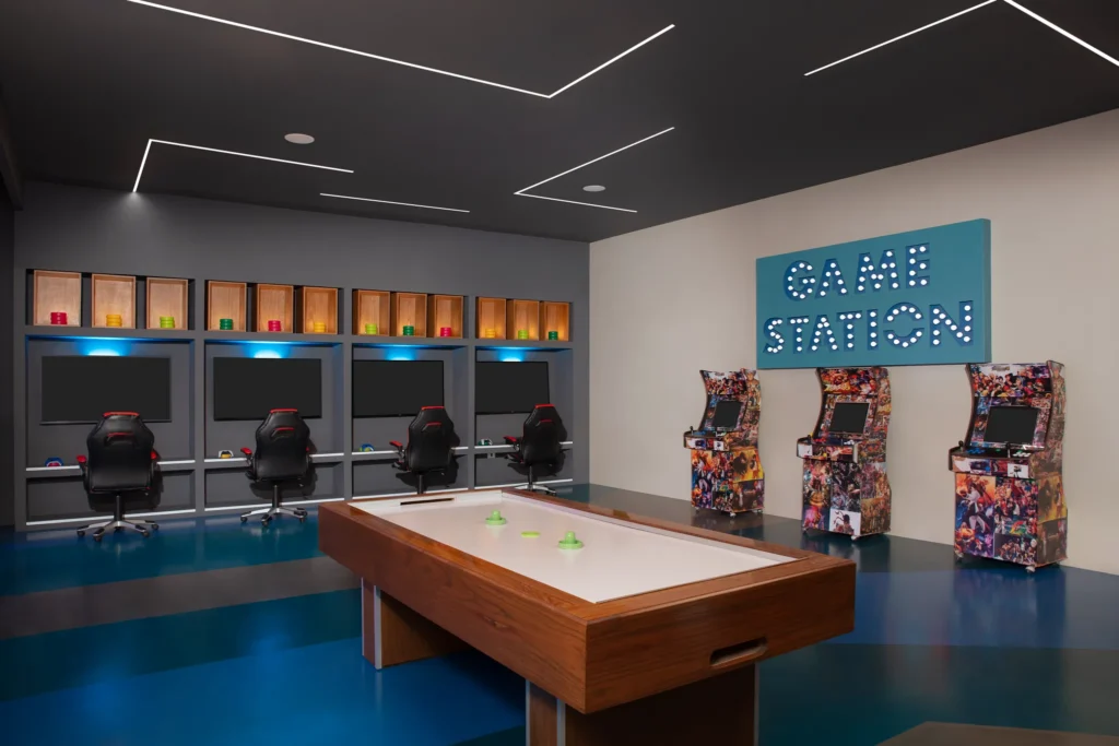 Modern Core Zone game room at Dreams Sapphire Resort & Spa featuring arcade machines, gaming stations, and air hockey.